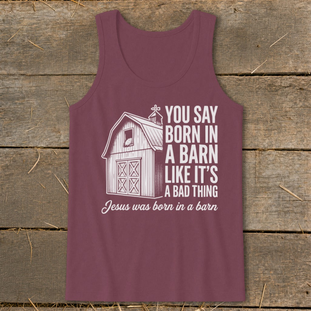 Burgundy tank top with barn graphic and text about Jesus being born in a barn.