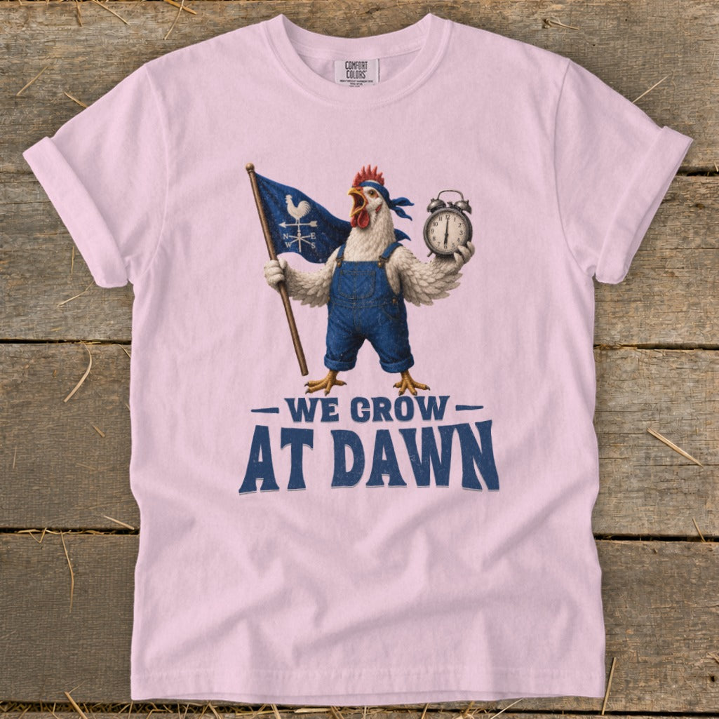 Chicken in overalls holding flag and alarm clock, text "WE GROW AT DAWN".