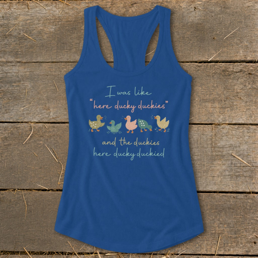 Blue tank top with cartoon ducks and text: "I was like 'here ducky duckies' and the duckies here ducky duckied."