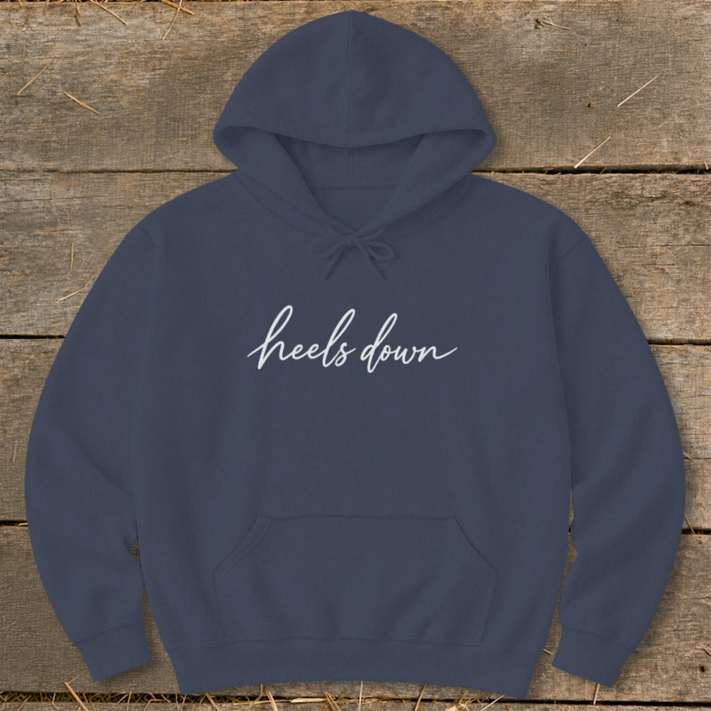 Navy blue hoodie with "heels down" in white cursive text.