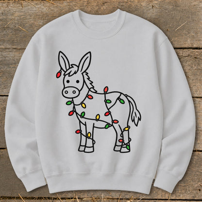Line drawing of a donkey wrapped in colorful Christmas lights on a white sweatshirt.