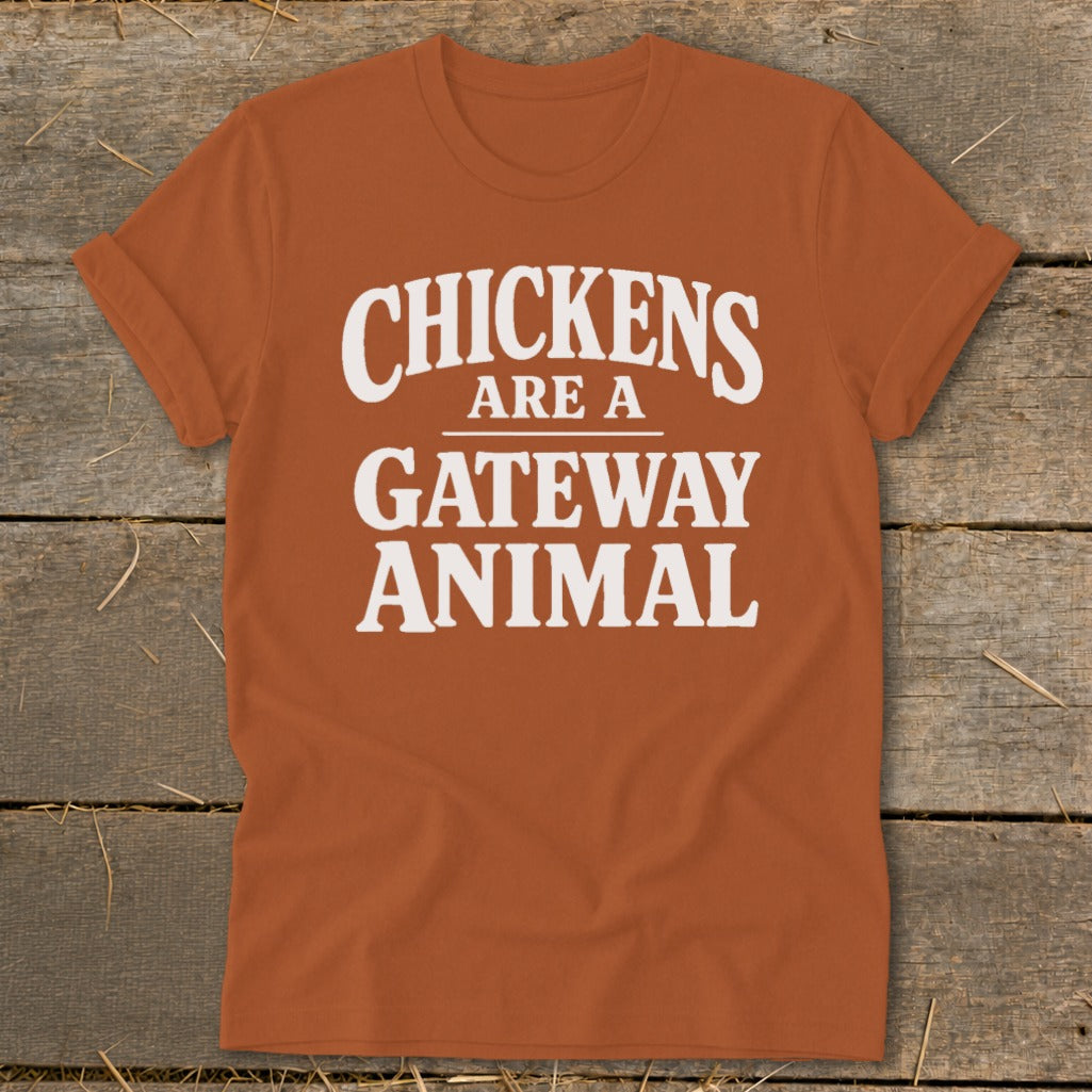 Orange t-shirt with white text that reads "Chickens Are A Gateway Animal".