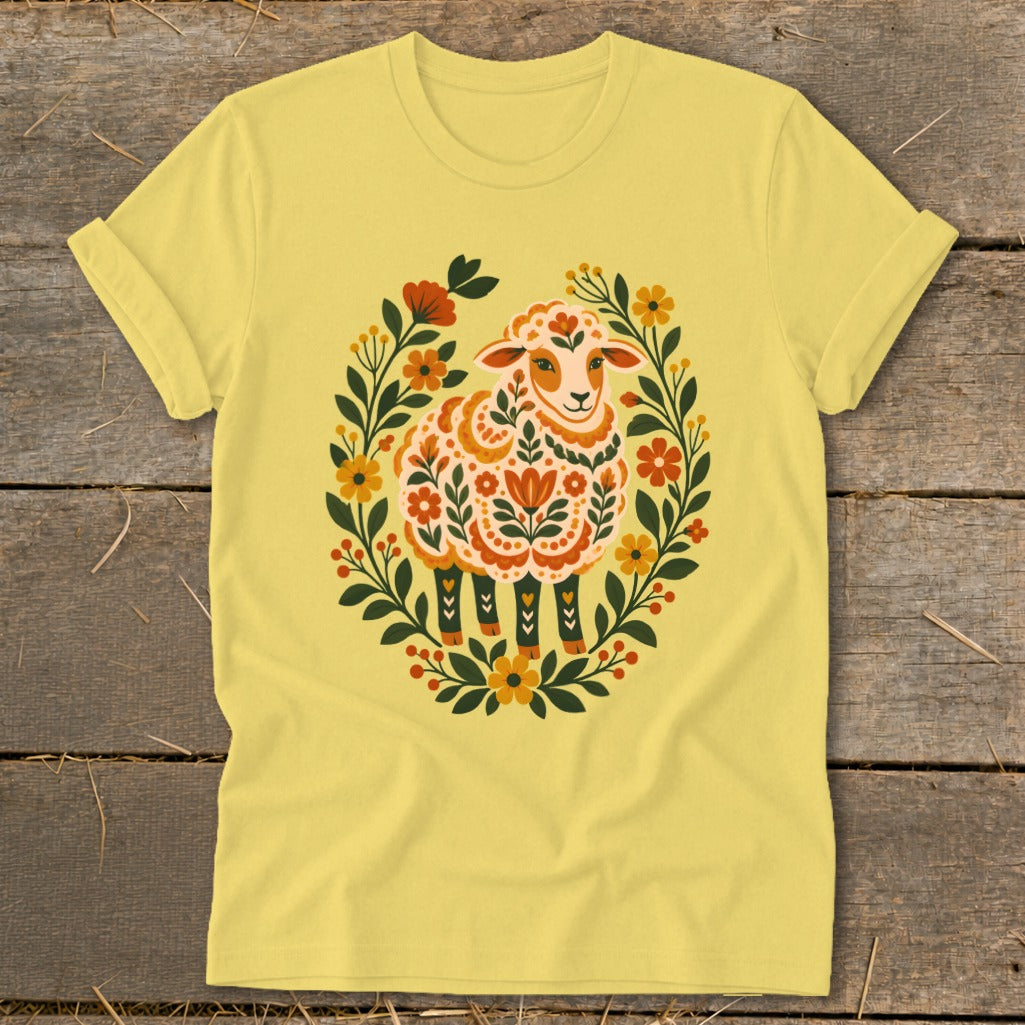 Yellow t-shirt with folk art sheep and floral wreath design.