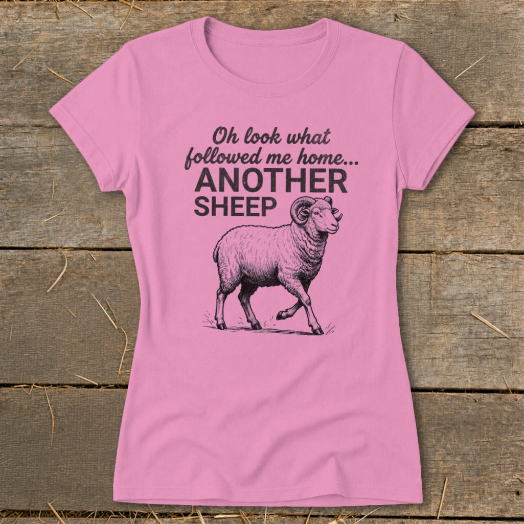 Pink t-shirt with sketch of sheep and text "Oh look what followed me home... ANOTHER SHEEP."