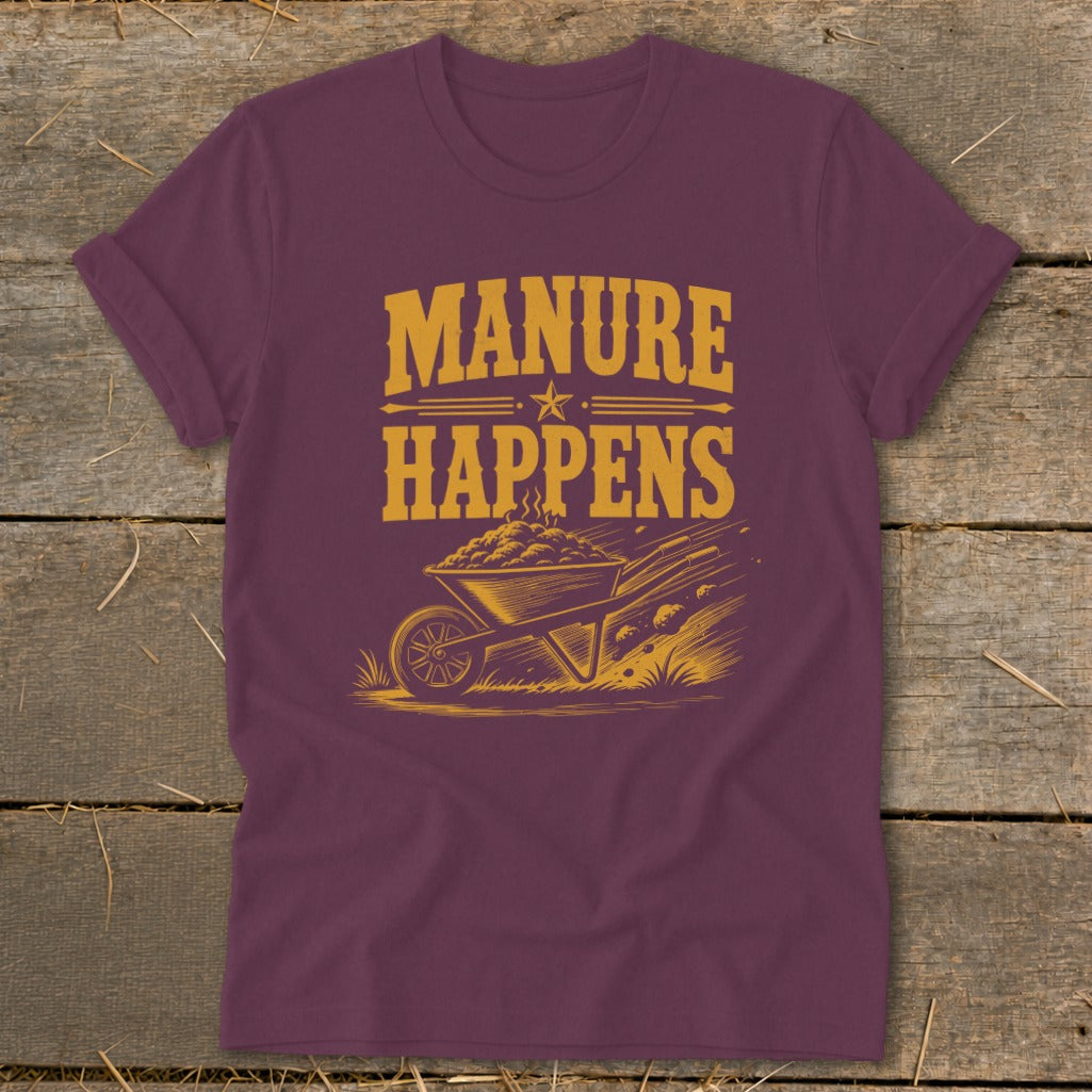 Maroon t-shirt with "Manure Happens" text and wheelbarrow graphic.
