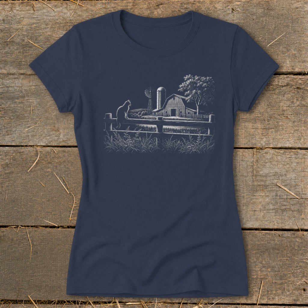 Navy t-shirt with a white sketch of a cat on a fence, barn, windmill, and tree.