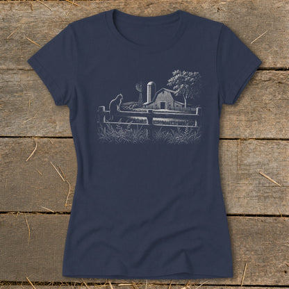 Navy t-shirt with a white sketch of a cat on a fence, barn, windmill, and tree.