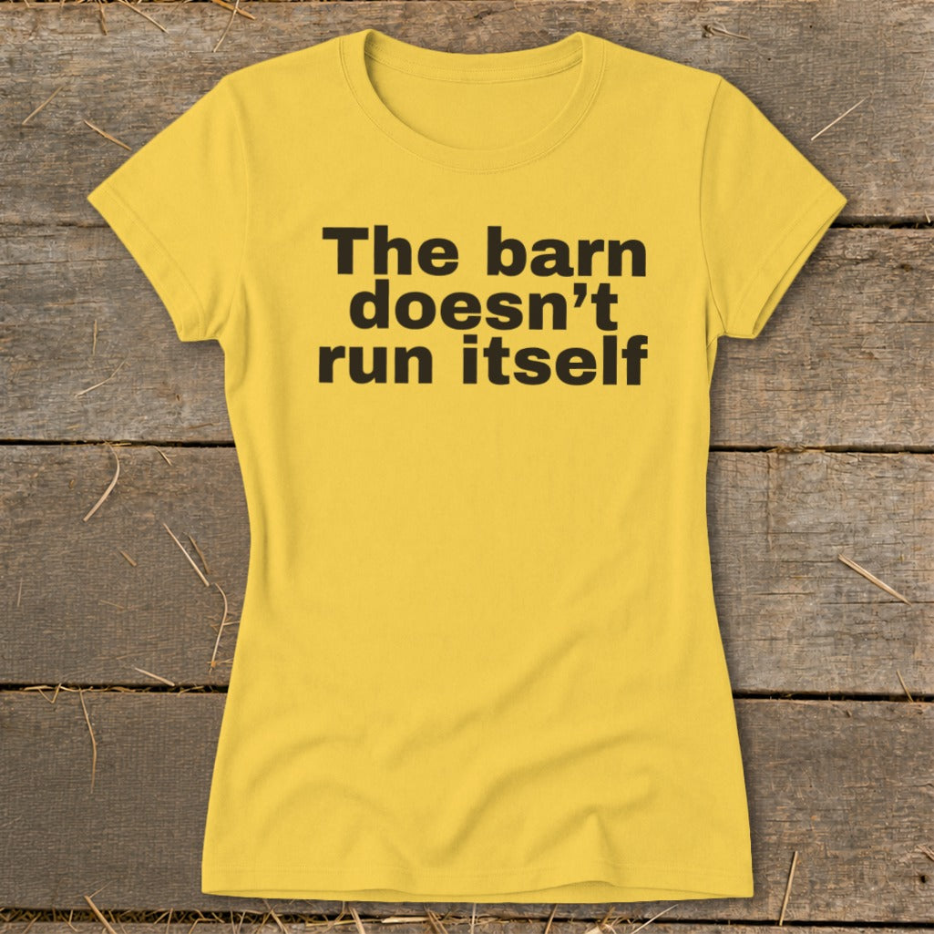 Yellow t-shirt with black text: "The barn doesn't run itself."