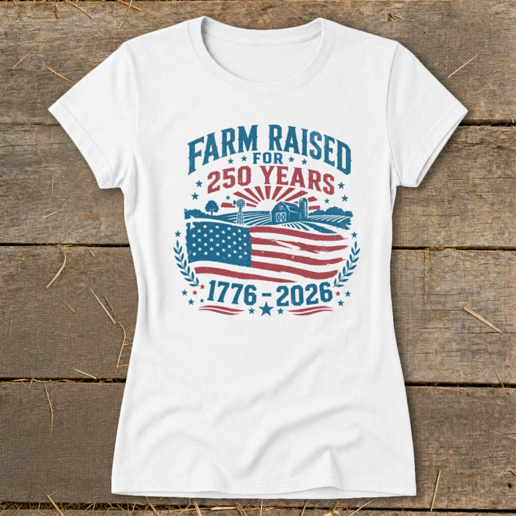 White t-shirt with "Farm Raised For 250 Years 1776-2026" text and American flag design.