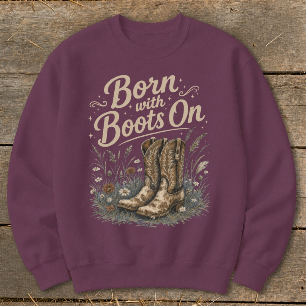 Burgundy sweatshirt with "Born with Boots On" text and cowboy boots illustration.