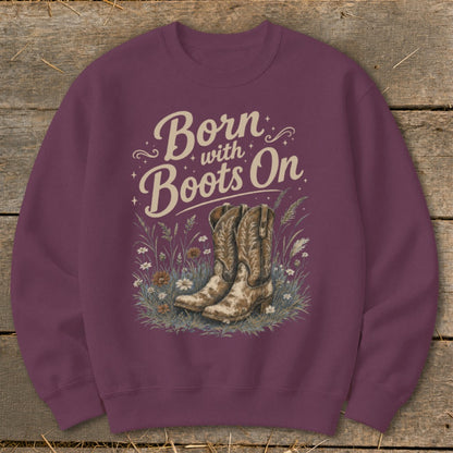 Burgundy sweatshirt with "Born with Boots On" text and cowboy boots illustration.