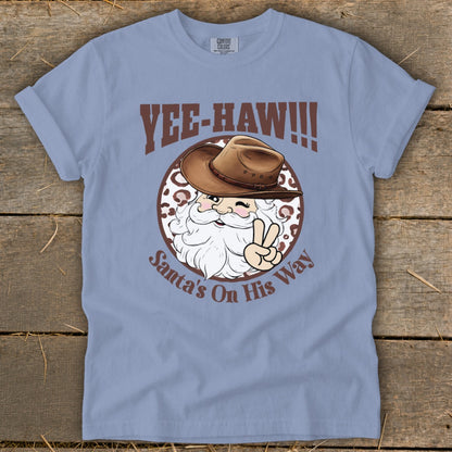 Santa wearing cowboy hat and giving peace sign with "YEE-HAW!!!" and "Santa's On His Way" text.