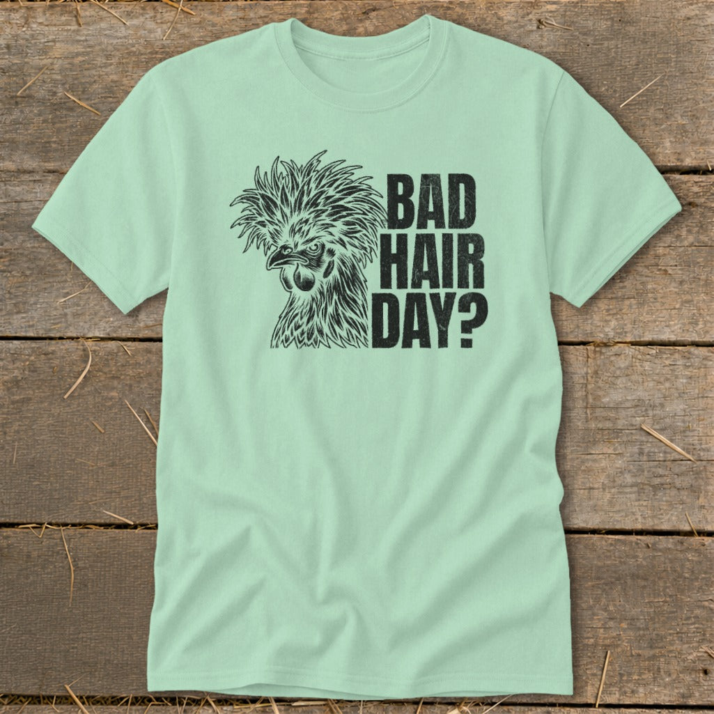 Light green t-shirt with black graphic of a chicken and text "BAD HAIR DAY?".