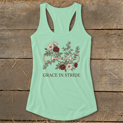 Mint green racerback tank top with floral bridle design and "Grace in Stride" text.