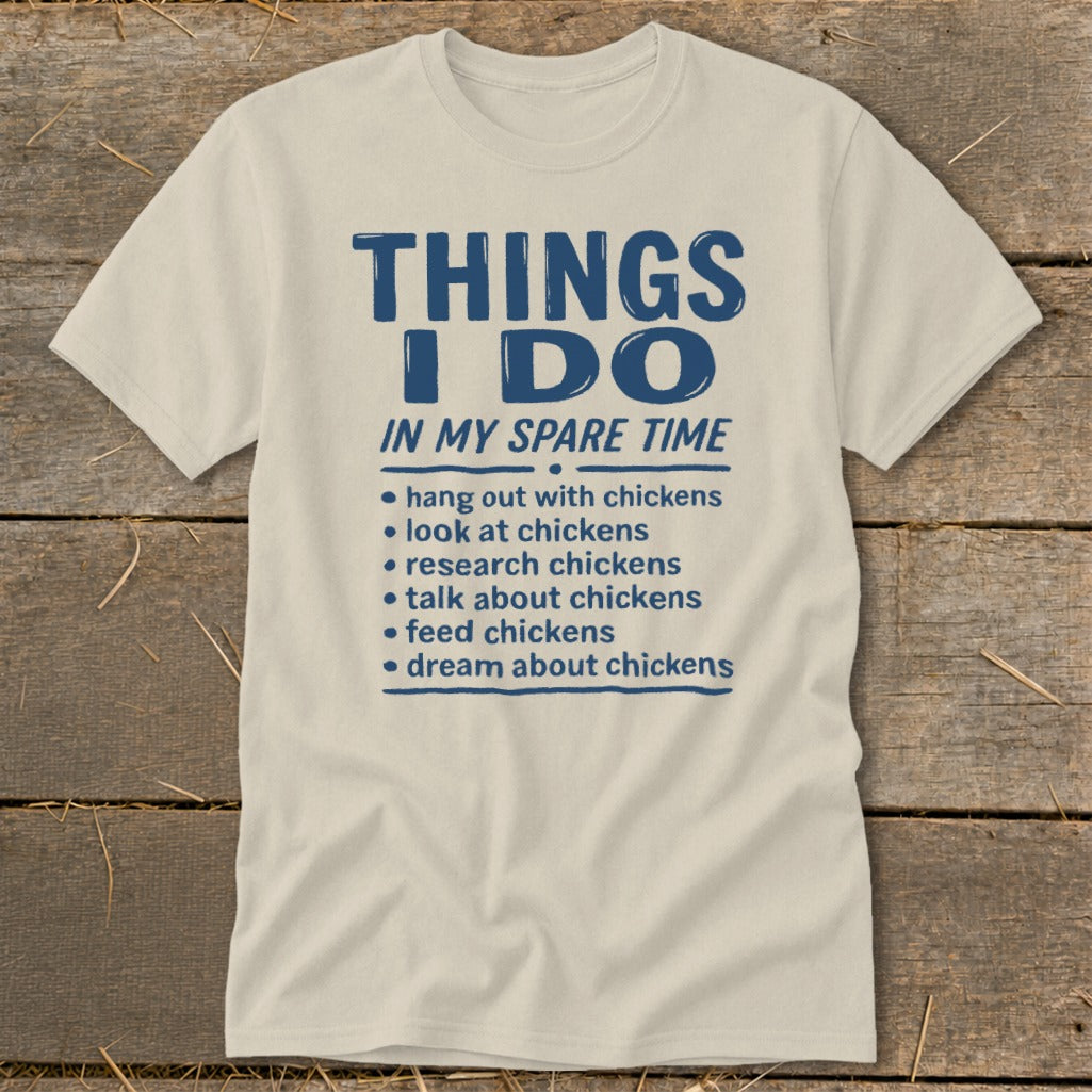 Light cream t-shirt with blue text listing chicken-related activities.