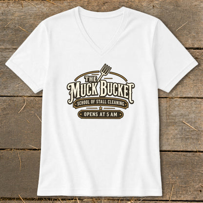 White t-shirt with "The Muck Bucket School of Stall Cleaning Opens at 5 AM" logo.