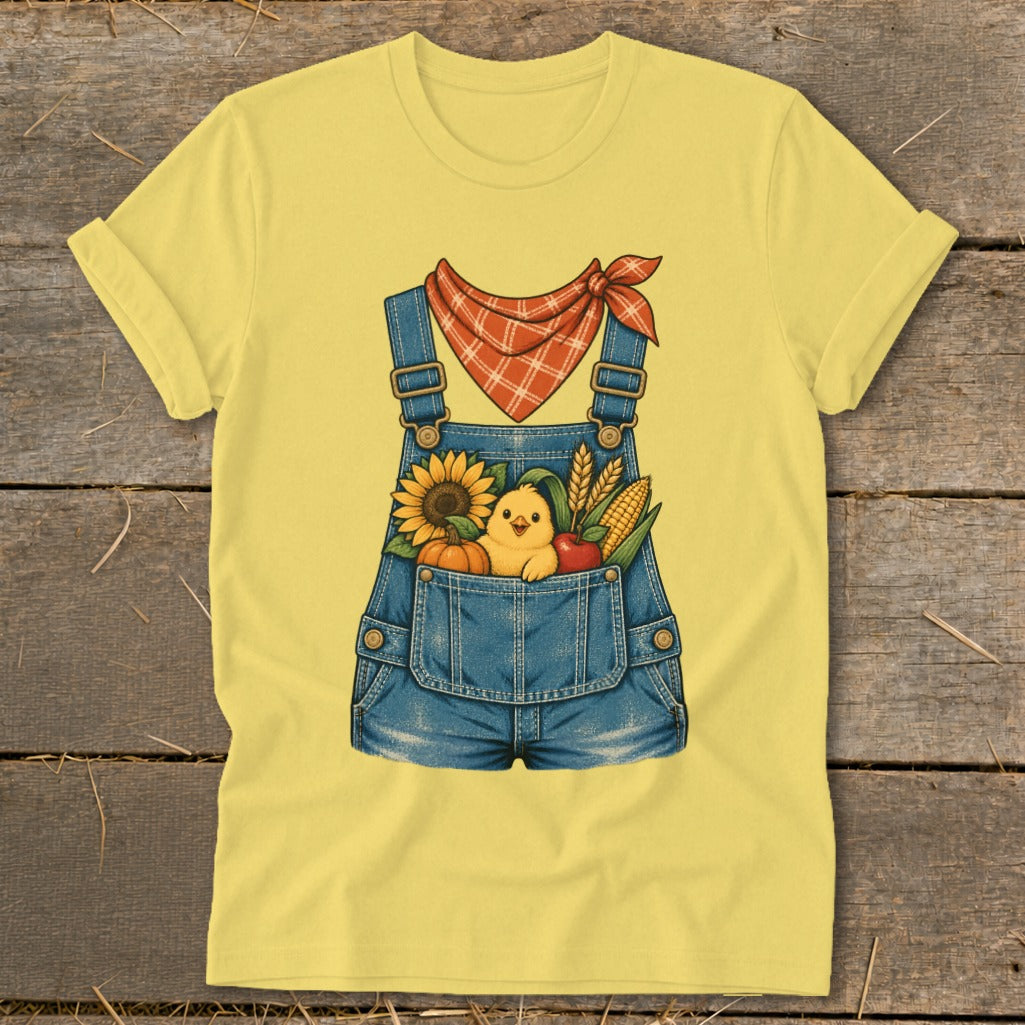 Yellow t-shirt with denim overalls graphic featuring a chick and harvest items.