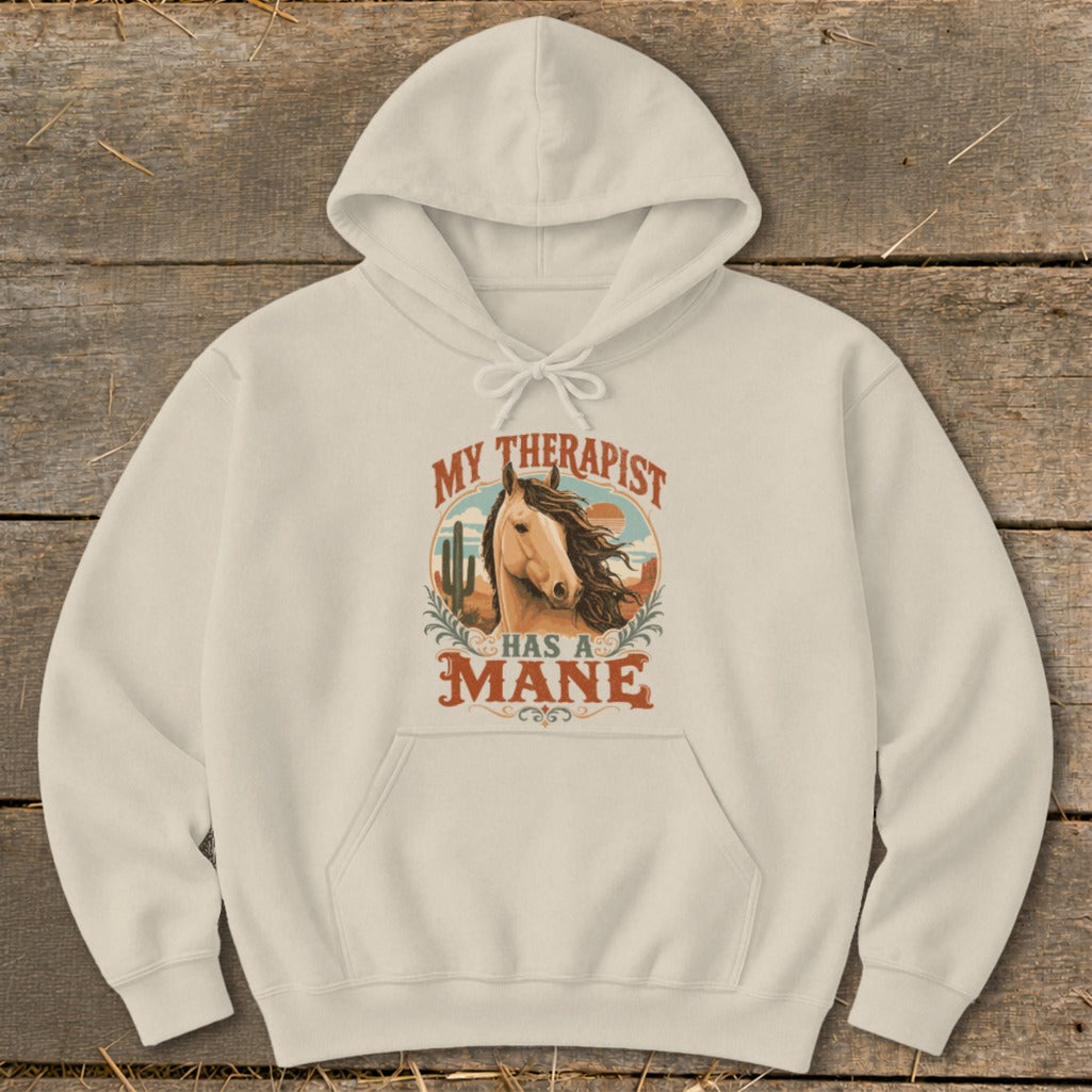Cream hoodie with "My Therapist Has a Mane" text and horse illustration.