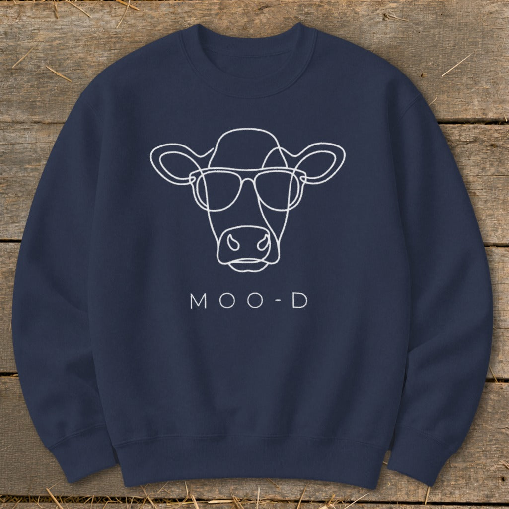Navy sweatshirt with white line art cow wearing sunglasses and "MOO-D" text.