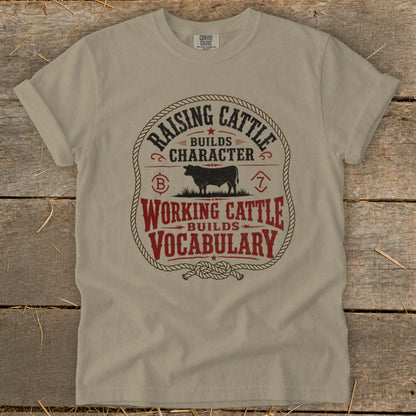 T-shirt with "Raising cattle builds character" and "Working cattle builds vocabulary" text.