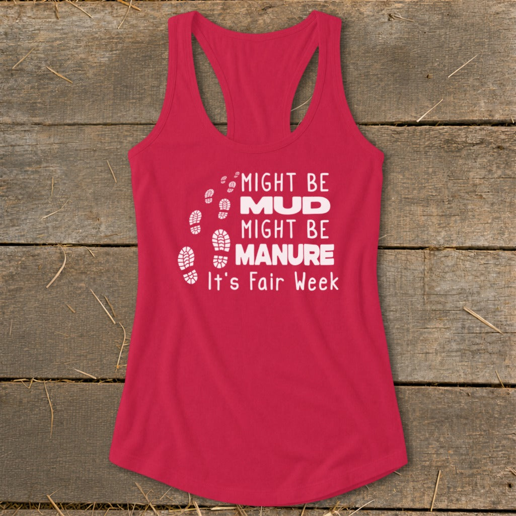 Pink tank top with white text "Might Be Mud, Might Be Manure, It's Fair Week" and footprints.