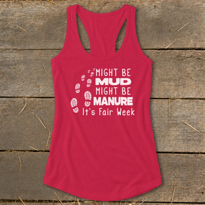 Pink tank top with white text "Might Be Mud, Might Be Manure, It's Fair Week" and footprints.