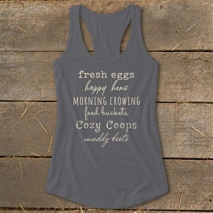 Gray tank top with text "fresh eggs happy hens MORNING CROWING feed buckets Cozy Coops muddy boots".