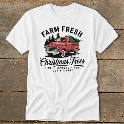 White t-shirt with red vintage truck carrying Christmas trees and text "FARM FRESH Christmas Trees".