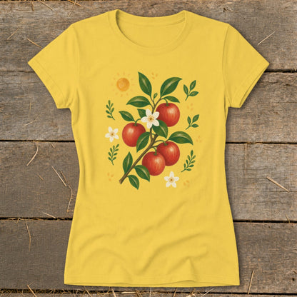 Yellow t-shirt with a graphic of a branch with red apples and white flowers.