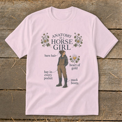 Pink t-shirt with "Anatomy of a Horse Girl" graphic detailing barn hair, hay, muck boots, and heart of gold.