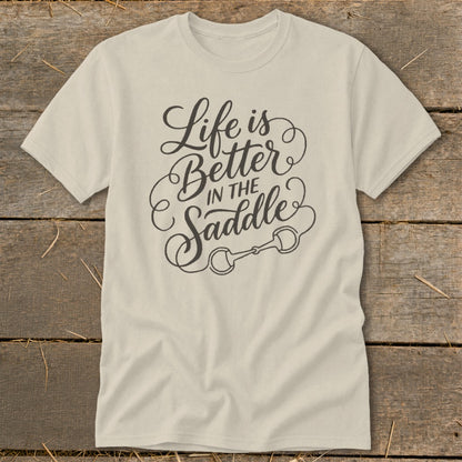 Cream t-shirt with "Life is Better In The Saddle" text and horse bit graphic.