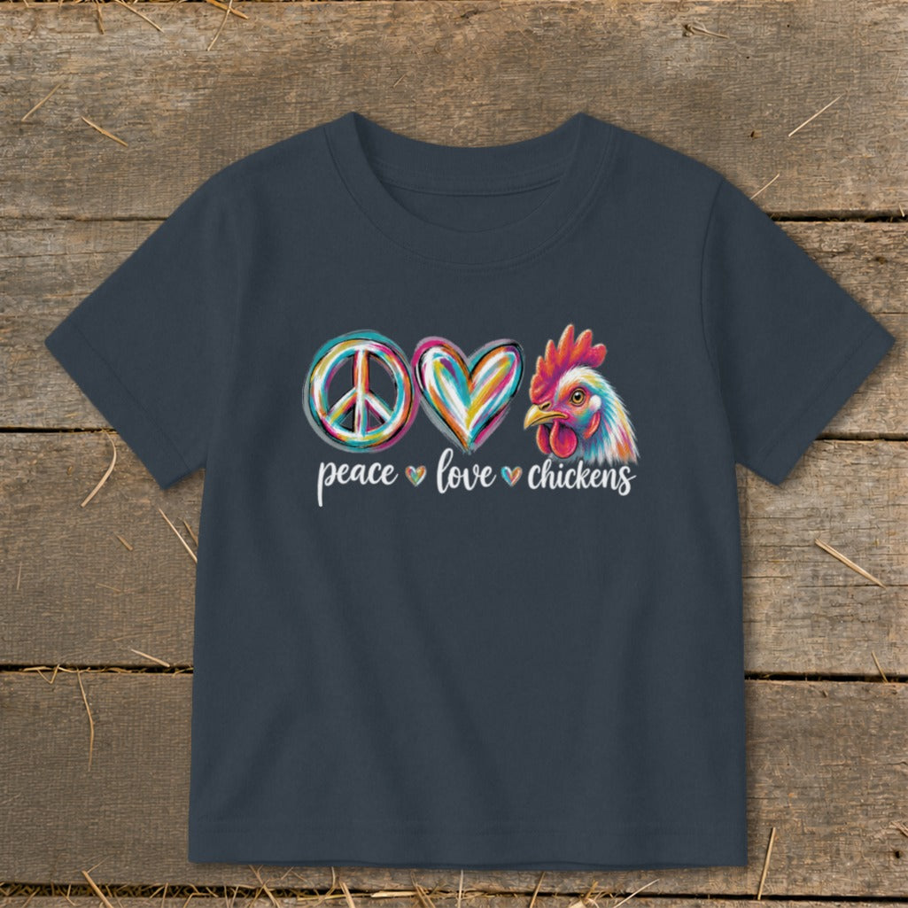 Peace, love, and chicken graphic with colorful symbols and text on a t-shirt.