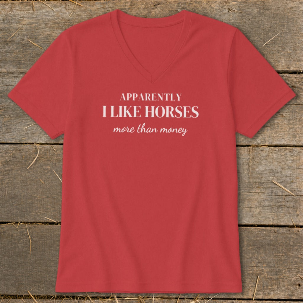 Red v-neck t-shirt with white text "APPARENTLY I LIKE HORSES more than money".