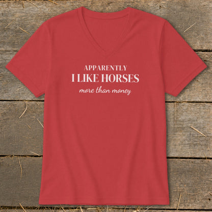 Red v-neck t-shirt with white text "APPARENTLY I LIKE HORSES more than money".