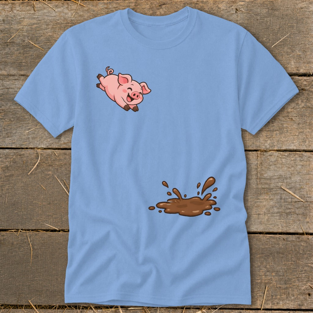 Blue t-shirt with a cartoon pig jumping over a mud puddle graphic.