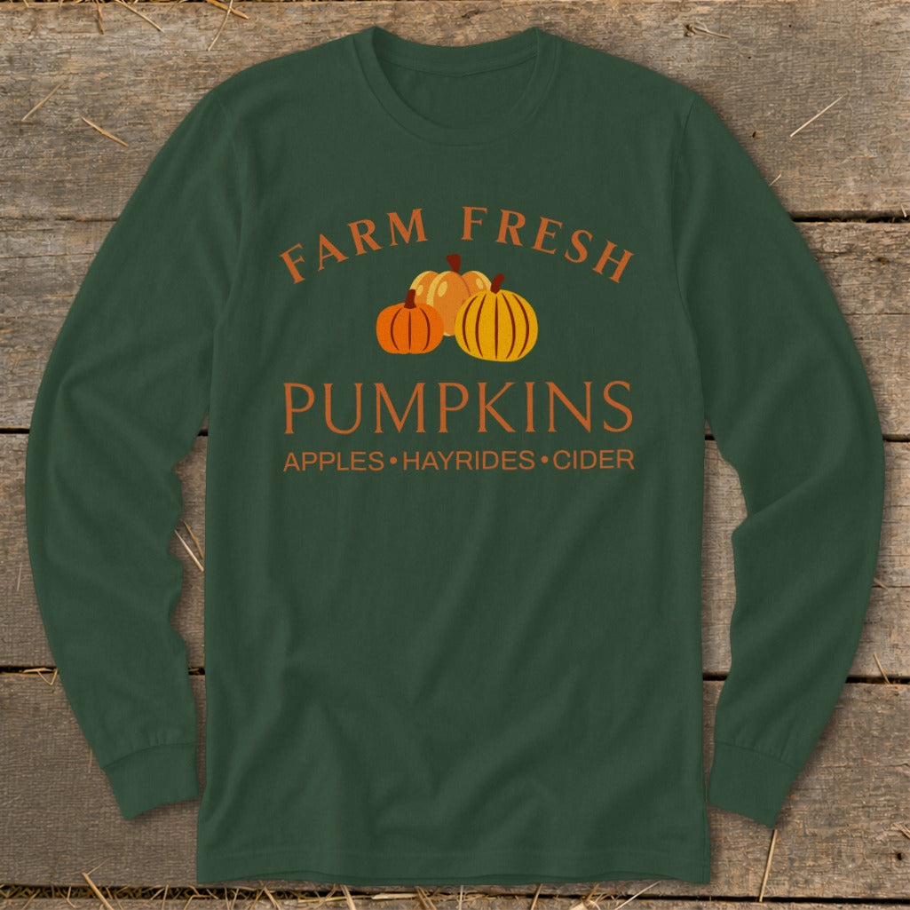 Dark green long-sleeve shirt with "Farm Fresh Pumpkins" and "Apples Hayrides Cider" text.