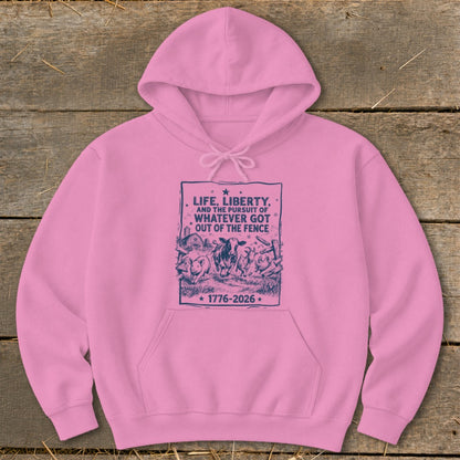 Pink hoodie with dark blue graphic: "Life, Liberty, and the Pursuit of Whatever Got Out of the Fence 1776-2026"