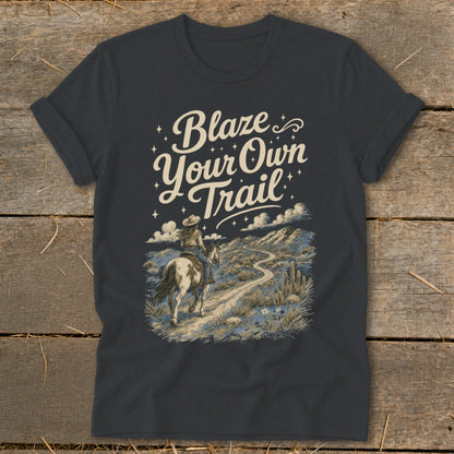 Dark gray t-shirt with "Blaze Your Own Trail" and a woman on horseback in a desert landscape.