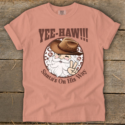 T-shirt graphic of Santa in a cowboy hat with text "YEE-HAW!!!" and "Santa's On His Way".