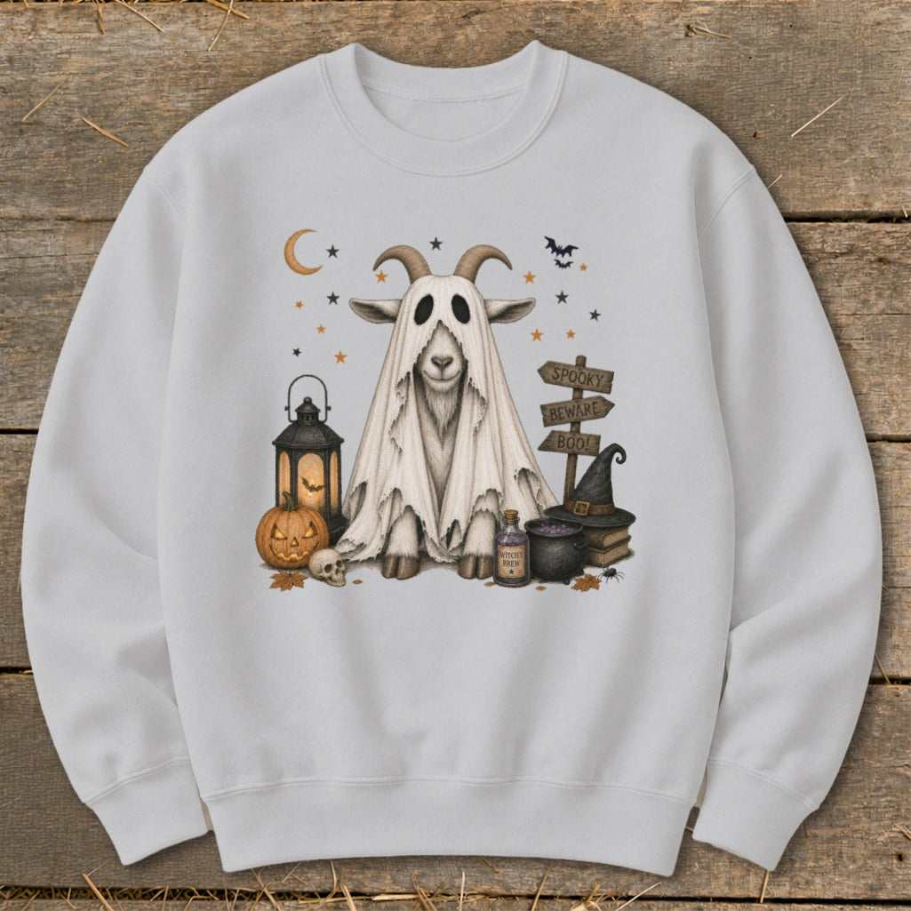 Ghost goat with Halloween decorations including pumpkin, lantern, and witch hat.