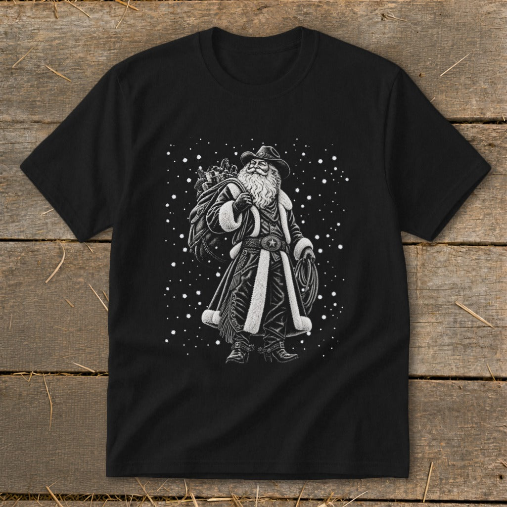 Black t-shirt with a cowboy Santa design holding a lasso and gift sack.