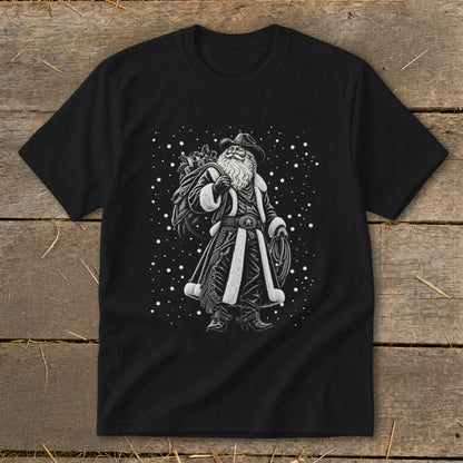 Black t-shirt with a cowboy Santa design holding a lasso and gift sack.