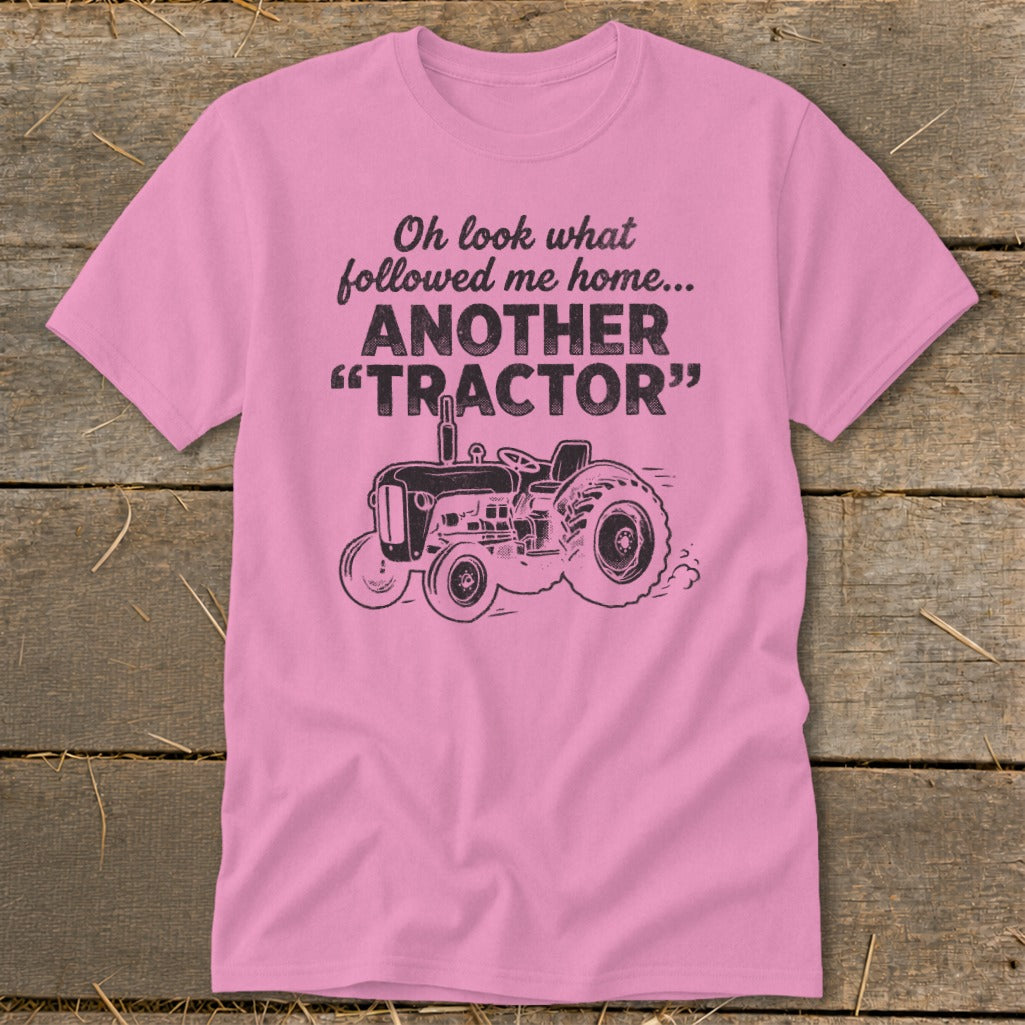 Pink t-shirt with "Oh look what followed me home... ANOTHER 'TRACTOR'" text and tractor graphic.