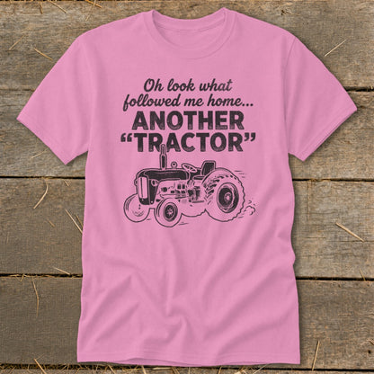 Pink t-shirt with "Oh look what followed me home... ANOTHER 'TRACTOR'" text and tractor graphic.