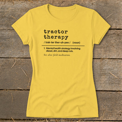 Yellow t-shirt with black text defining "tractor therapy" and "field meditation."