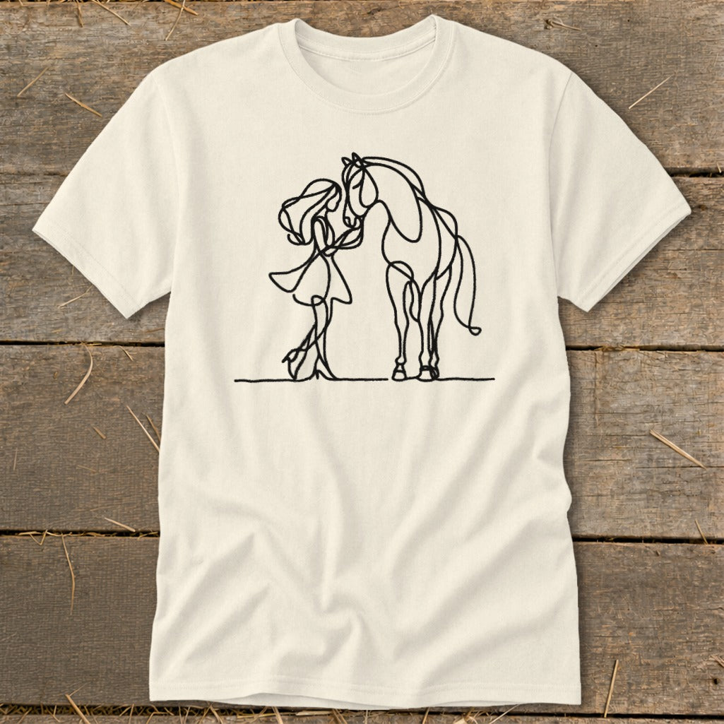 Line art of a girl and horse on a cream t-shirt.