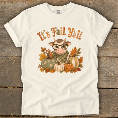 White t-shirt with a cow wearing glasses and a bandana surrounded by pumpkins.