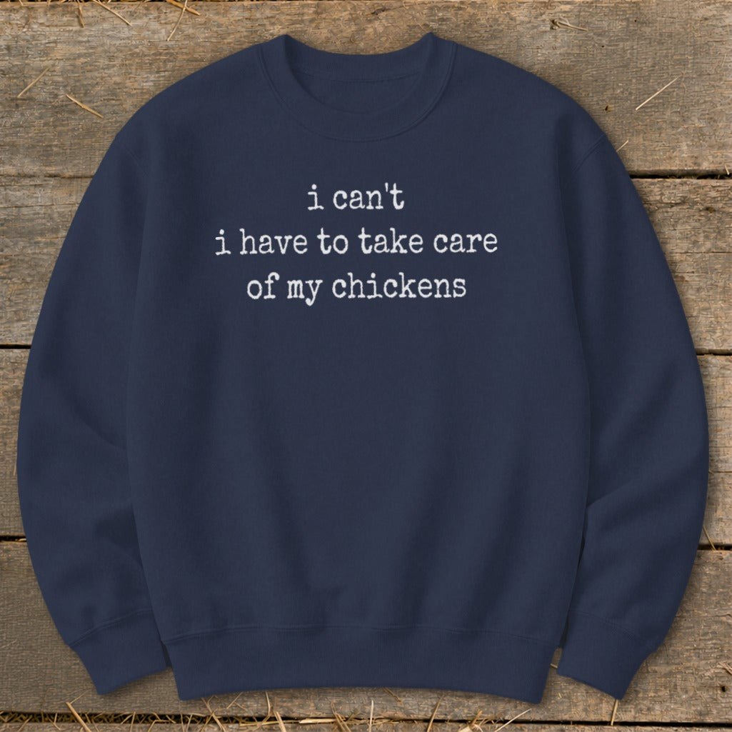 Navy sweatshirt with white text that reads "i can't i have to take care of my chickens."