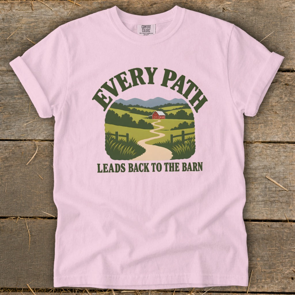 Pink t-shirt with a graphic of a barn and landscape with text "EVERY PATH LEADS BACK TO THE BARN".