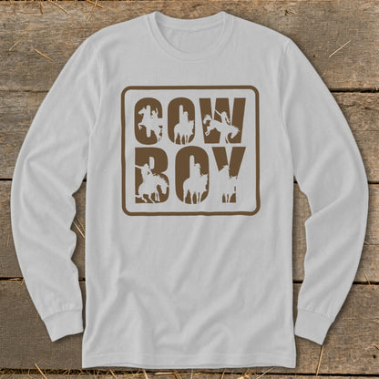 White long sleeve shirt with brown "Cowboy" text and horse rider silhouettes.